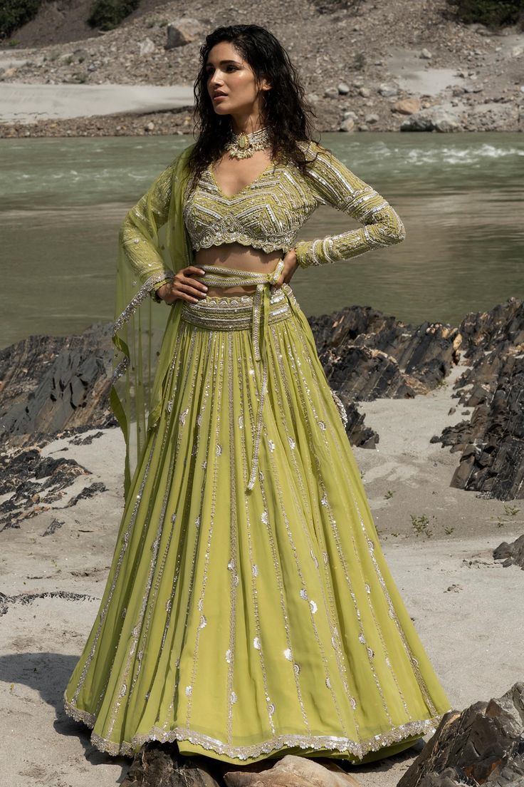 Citrus lehenga with mirror, sequin and pearl embroidery. Paired with embroidered blouse and embroidered dupatta.
Component: 3
Pattern: Embroidered
Type Of Work: Mirror, Sequins and Pearls
Neckline: V Neck
Sleeve Type: Full Sleeves
Fabric: Georgette
Color: Green
Other Details: 
Mirror and sequin work
Note: Belt worn by the model is not for sale
Occasion: Wedding,Bride - Aza Fashions Mirror Sequin, Pearl Embroidery, Green Mirror, Embroidered Lehenga, Bridal Lehengas, Embroidered Dupatta, Full Sleeves, Bridal Lehenga, Embroidered Blouse