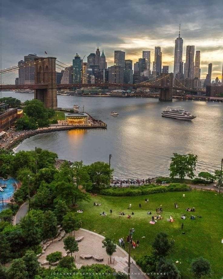 an aerial view of the brooklyn bridge and lower manhattan