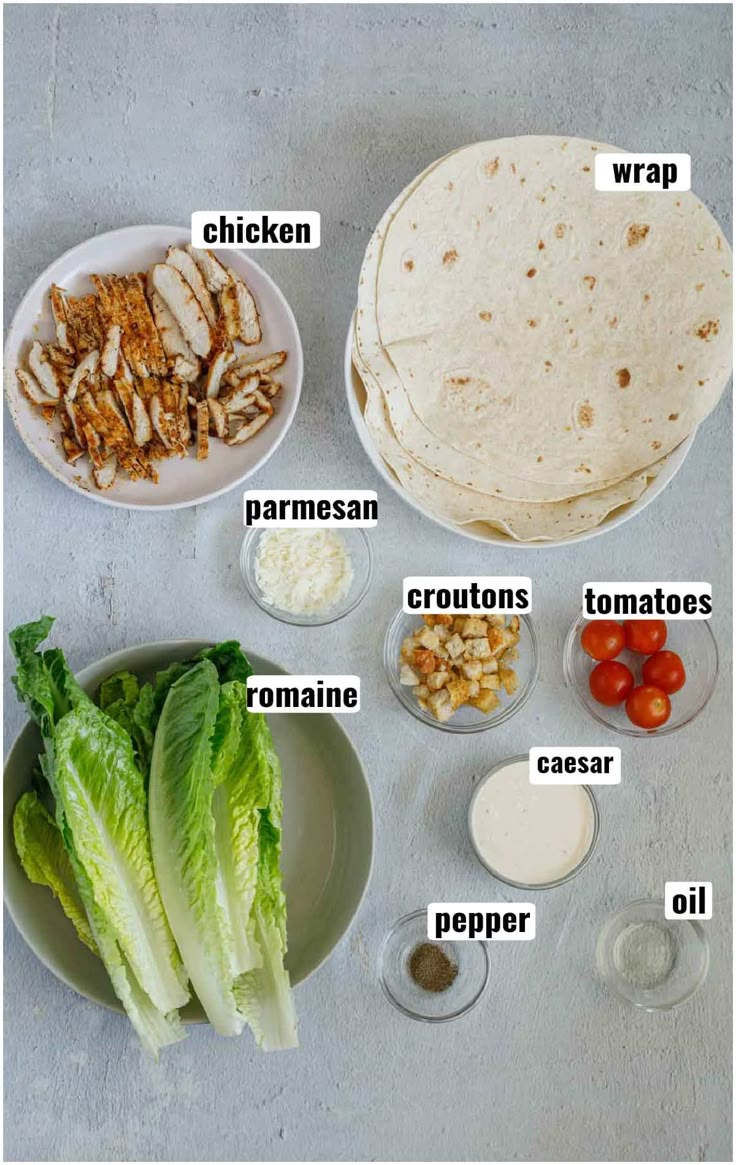 the ingredients to make chicken wraps are shown on a white table with a gray background