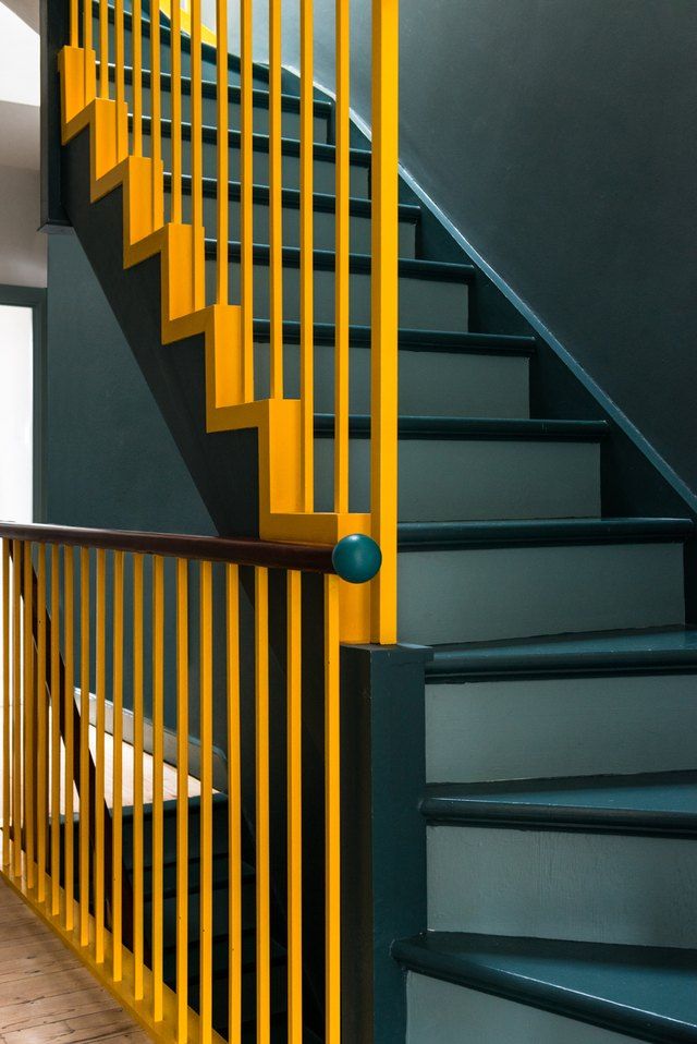 the stairs are painted blue and yellow