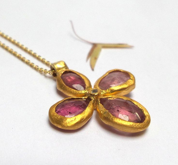 Tourmaline Flower Pendant - Beautiful Pink Tourmaline stone inlaid in 24K solid gold. inlaid diamond. The Pink Tourmaline flower pendant length 22mm. The Pink Tourmaline flower pendant - 440$. The Pink Tourmaline and diamond flower pendant in 18k solid gold Chain length 45cm - 660$. The pink Tourmaline and diamond flower pendant in oxidized sterling silver chain 50cm - 480$. Please let me know how do your necklace. Free Shipping The pendant will be packed in a Beautiful gift box. Your necklace w Gold Flower-shaped Gemstone Jewelry, Gold Flower Shaped Jewelry With Gemstone, Gold Flower Gemstone Jewelry, Gold Gemstone Necklaces With Flower Design, Yellow Gold Flower Necklace With Gemstone, Yellow Gold Flower Shaped Gemstone Necklace, Yellow Gold Gemstone Necklace In Flower Shape, Yellow Gold Flower-shaped Gemstone Necklace, Gold Flower Shaped Gemstone Necklace