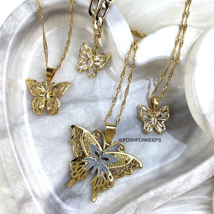 DESCRIPTION: Part of our exclusive "The Butterfly Effect Collection", this gorgeous high polish 18K Gold Plated Butterfly Kiss Choker is a must have piece! Perfectly placed on a classic Figaro chain, this butterfly charm is embedded with the highest quality of baguette cut Cubic Zirconia crystals that shines like crazy in any kind of lighting! MATERIAL: 18K Gold Plated over Stainless Steel. Hypoallergenic, Tarnish Free and Water Resistant. LENGTH: 16 inches. Pendant: 0.5 in. Matching Butterfly A Kiss Necklace, The Butterfly Effect, Butterfly Anklet, Butterfly Lace, Charm Anklet, Butterfly Collection, 18k Gold Necklace, Lace Necklace, Butterfly Kisses