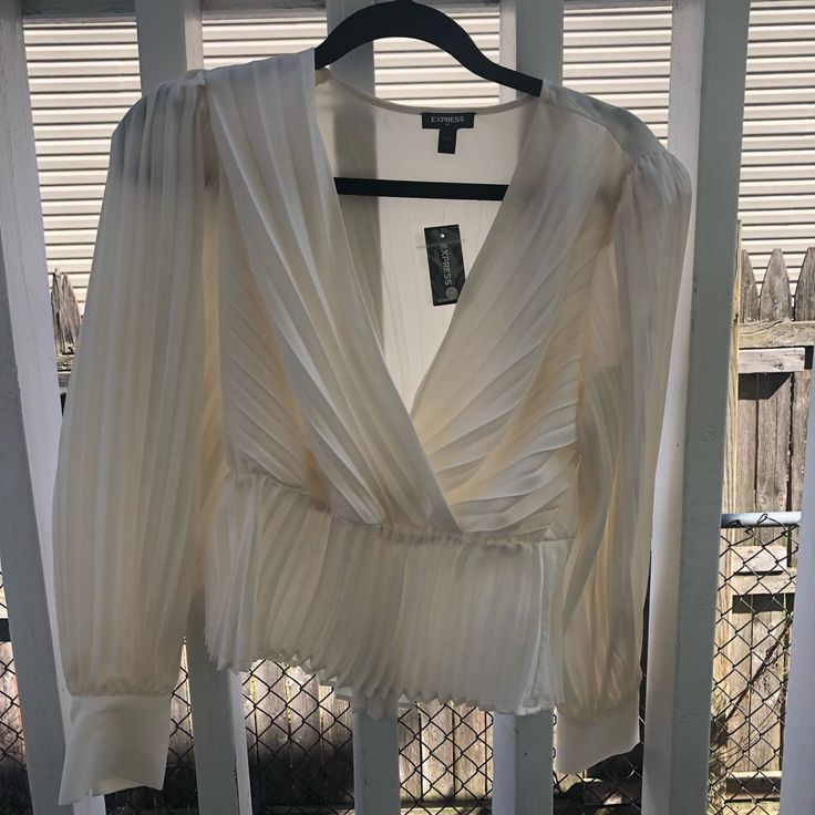 I Bought It For Christmas , Never Used . Original Price $80 , I Paid $40. I’m Selling Because I Loose Some Weight And I Dont Like The Way It Looks On Me. It Is Very Pretty , For A Wedding , Babyshower , Birthday Is Really Beautiful. Elegant V-neck Holiday Tops, Chic Pleated Tops For Night Out, Spring Party Pleated Tops, Holiday V-neck Blouse For Night Out, Chic Pleated V-neck Top, Elegant Pleated Party Tops, Chic V-neck Holiday Tops, Fitted Pleated Blouse For Party, Spring Pleated Blouse For Night Out