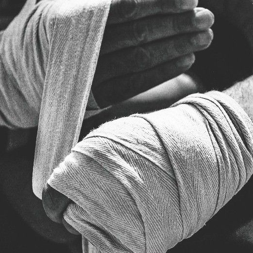 a black and white photo of someone's hands holding something