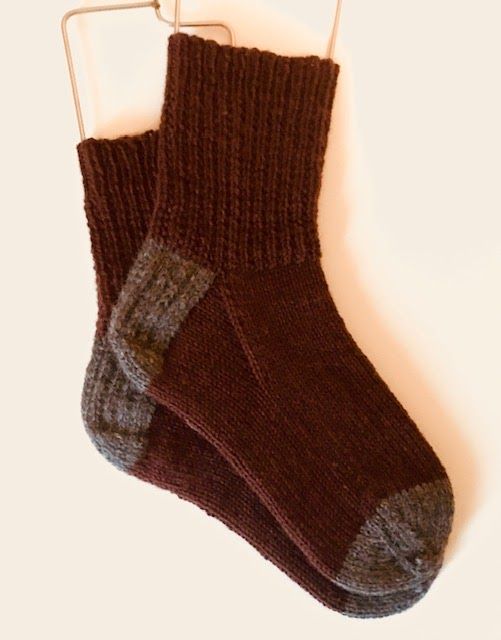 a pair of brown socks hanging on a clothes rack