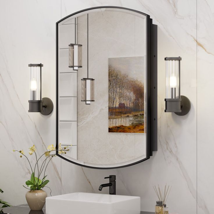 a bathroom with a sink, mirror and art work on the wall above it's counter