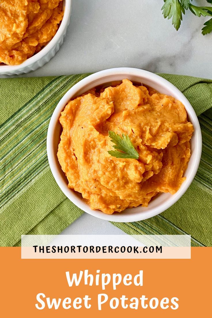 two bowls filled with whipped sweet potatoes on top of a green napkin next to some parsley