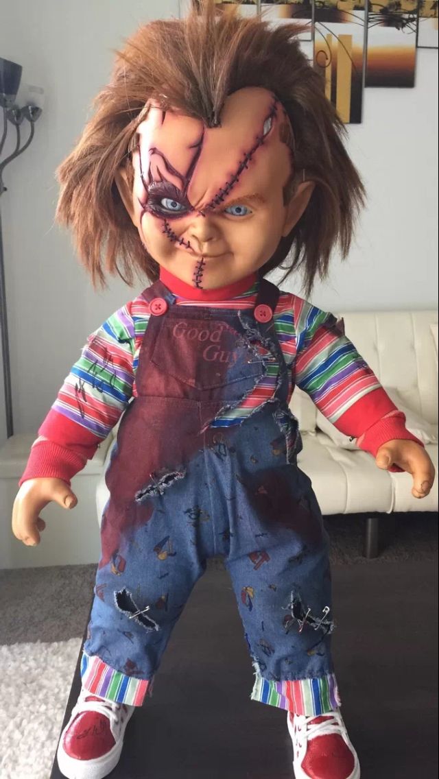 a doll with makeup and hair on it's face