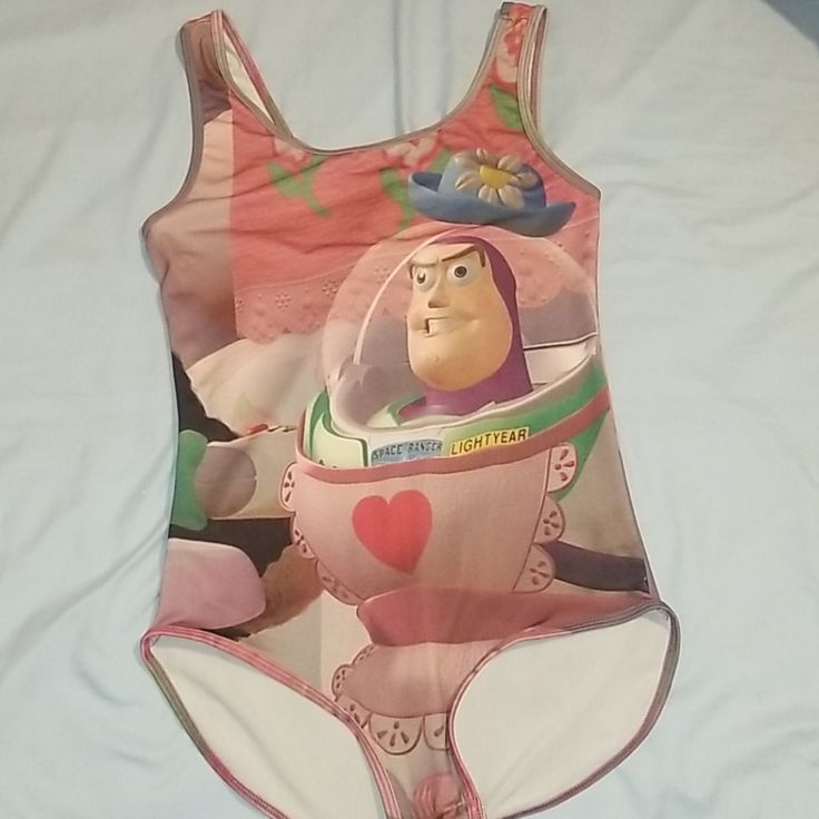 Toy Storys Buzz Lightyear Bodysuit. Soft Material. Stretchy Fabric. Size Large. Brand New Came With Out Tags. All Offers Welcome Playful Fitted Cartoon Print Swimwear, Fitted Pink Bodysuit With Cartoon Print, Pink Casual Bodysuit For Playwear, Playful Character Print Bodysuit For Playwear, Cute Multicolor Bodysuit For Playwear, Playful Fitted Bodysuit With Cartoon Print, Cute Fitted Bodysuit With Cartoon Print, Fitted Fun Bodysuit For Playwear, Fun Fitted Bodysuit For Playwear