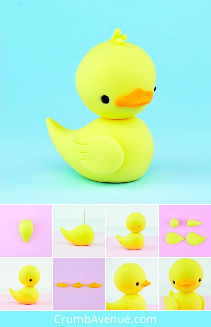 a yellow rubber duck sitting on top of a blue surface