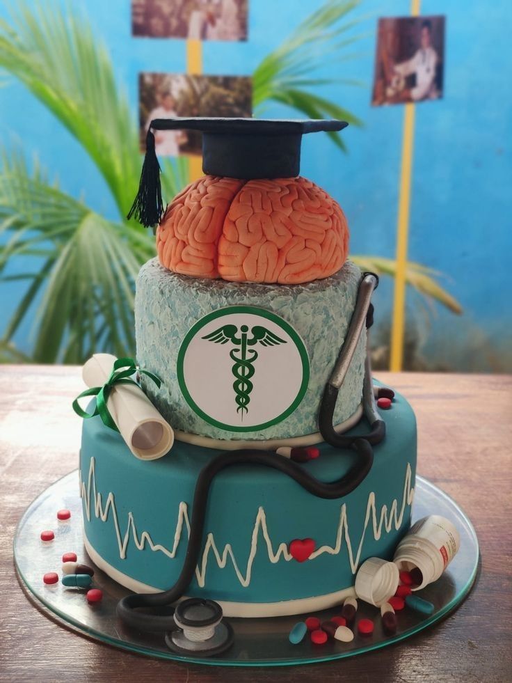 a cake with a medical theme on it and a stethoscope in the middle