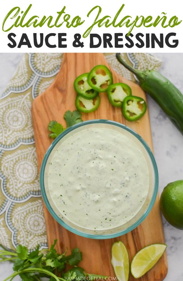 an image of a bowl of guacamole sauce and dressing on a cutting board