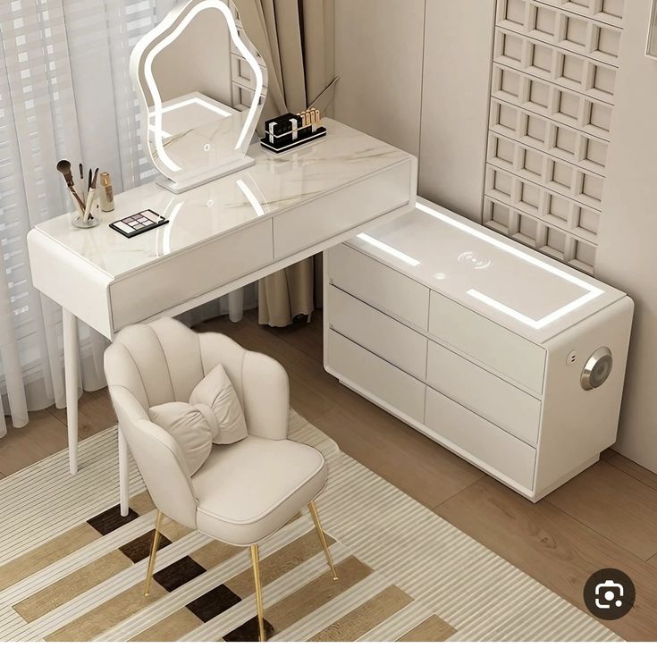 a white desk with a mirror and chair in front of it on top of a rug