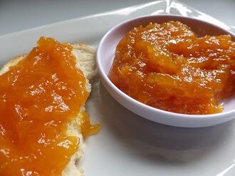 two pieces of bread on a plate with jam