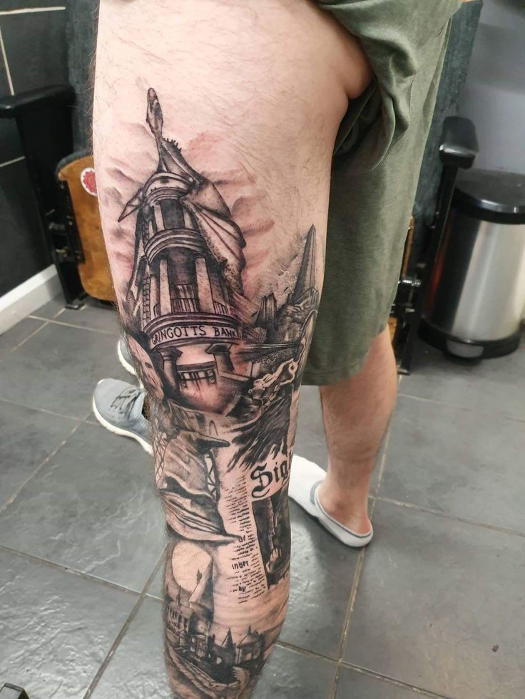 a man with a ship tattoo on his leg