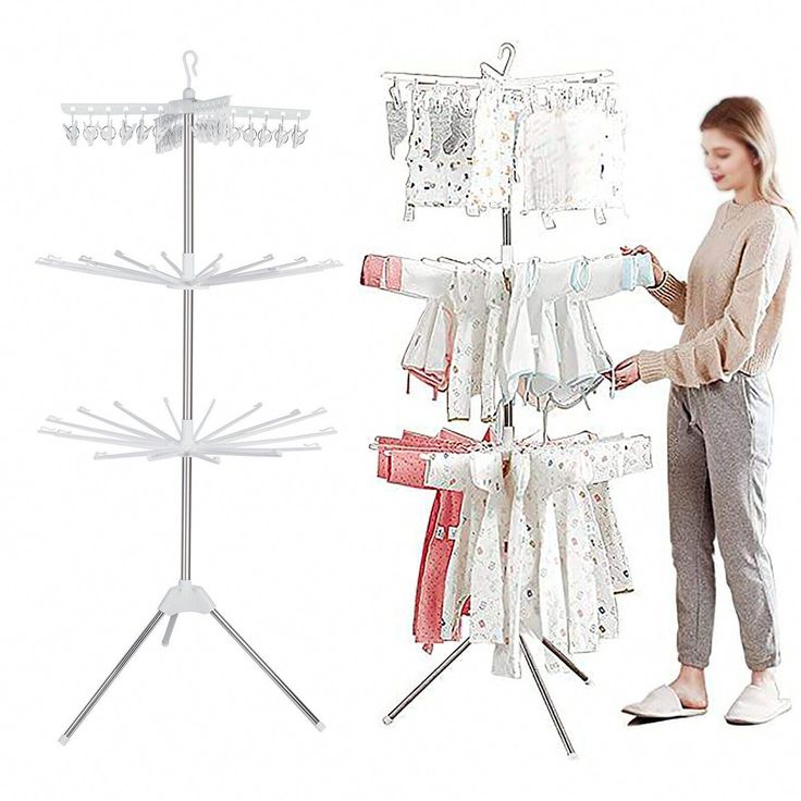 a woman standing next to a rack with clothes on it