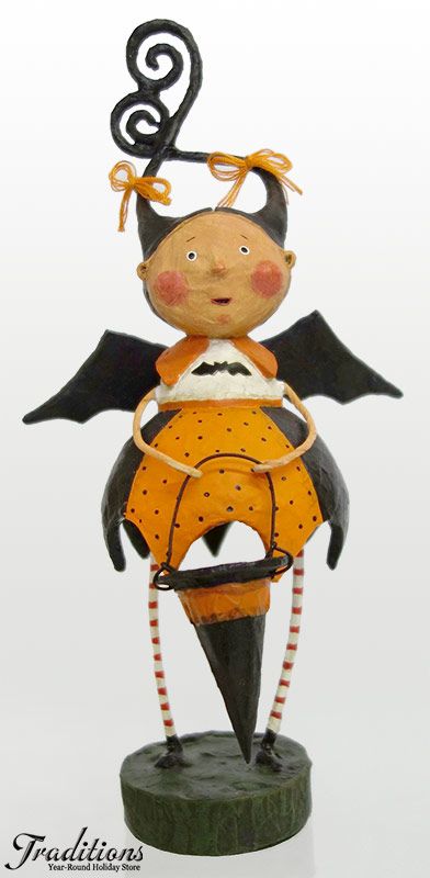 a figurine with an orange dress and black wings