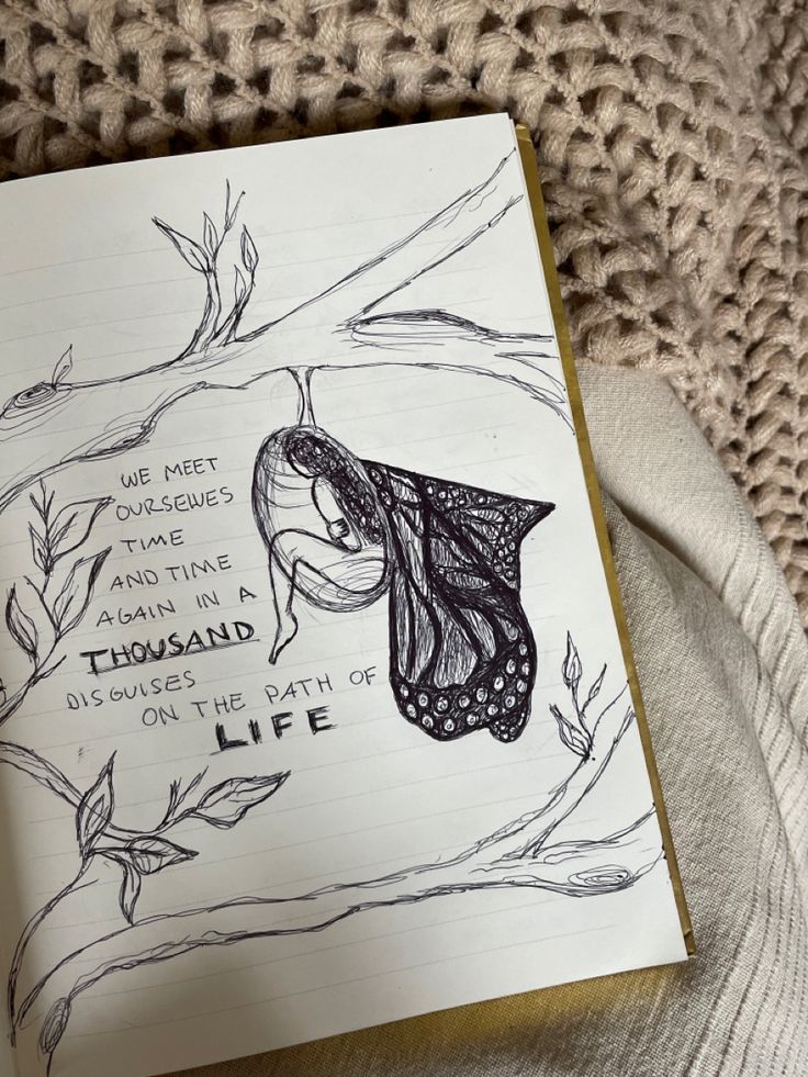 a drawing of a butterfly sitting on top of a tree branch next to a piece of paper