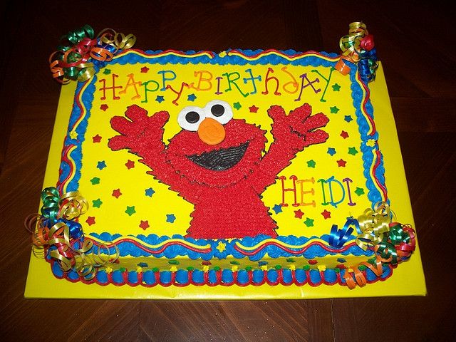 a birthday cake with an elmo face on it