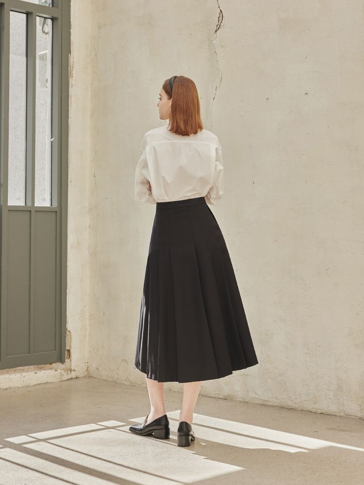 Editor's Notes The Aba skirt has a pleated design with a neat silhouette that creates a calm yet sophisticated mood with a maxi length using a solid texture material. It adds practicality with both side pockets and provides a comfortable fit with a side console zipper. It can be matched with various items and styled in a classic and casual mood. - Pleated design- Maxi length- Solid texture material- Both side pockets - Side console zipperMeasurements(in.)Size: Size (S/M)- Waist: 12.99in. / 13.97in.- Hip: 18.5in. / 19.29in.- Hem: 30.51in. / 30.9in.- Total Length: 31.69in. / 31.88in.Model info: Height 5' 61, Bust 32 in., Waist 23 in., Hip 34 in. / Wearing a size S Composition & Care- Fabric: 70% Polyester, 30% Rayon- Dry Cleaning Only- Lining  Designer- by&n Pleated Long Skirt, Long Skirt, Comfort Fit, How To Wear, Black