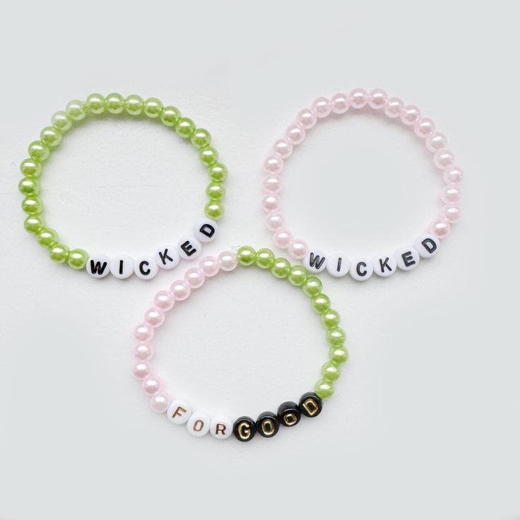 Wicked Bundle Elasticated Friendship bracelets inspired by the West End and Broadway show Wicked. Set of three: One green 'wicked', one pink 'wicked' one pink and green 'for good' * Other shows available * Bulk orders available  * Customisation available Wicked Gift Ideas, Wicked Friendship Bracelet, Wicked Party Ideas, Wicked Bracelet Ideas, Friendship Bracelets Green, Wicked Bracelet, Book Bracelets, Wicked Party, Bracelets Kandi