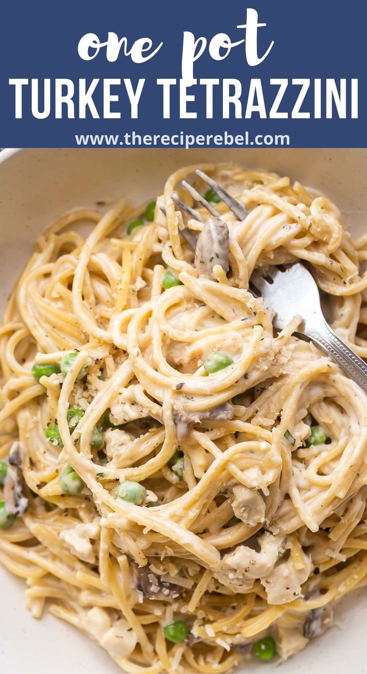 a white bowl filled with pasta and peas