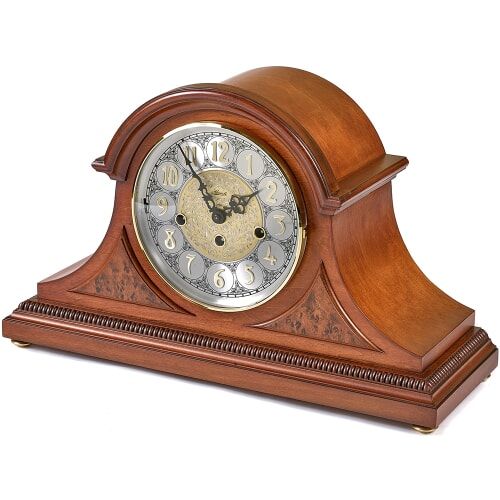 an old fashioned wooden clock with roman numerals