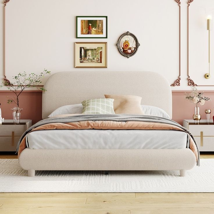 a bedroom with pink walls and white furniture