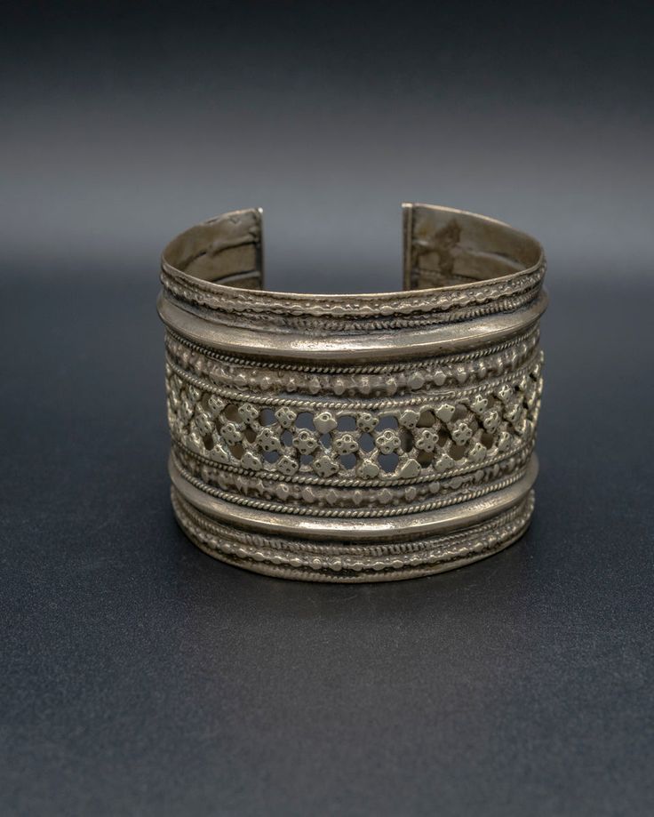 A beautiful relic from the past, this vintage silver cuff is crafted with passion by skilled artisans from the Turkman tribe, each design element tells a unique story waiting to be unraveled. This item will ship directly from Bali via DHL delivery. Please allow up to 15 business days to arrive. Handmade Vintage Antique Silver Jewelry, Handmade Vintage Jewelry In Antique Silver, Handmade Artisan Metal Cuff Bracelet, Handmade Bohemian Cuff Bracelet For Wedding, Unique Oxidized Metal Cuff Bracelet, Unique Metal Cuff Bracelet With Oxidized Finish, Handmade Sterling Silver Bracelet For Weddings And Festivals, Handmade Sterling Silver Wedding Bracelet For Festivals, Handmade Sterling Silver Bracelet For Wedding And Festivals