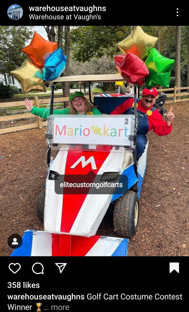 two people in a cart with kites on top