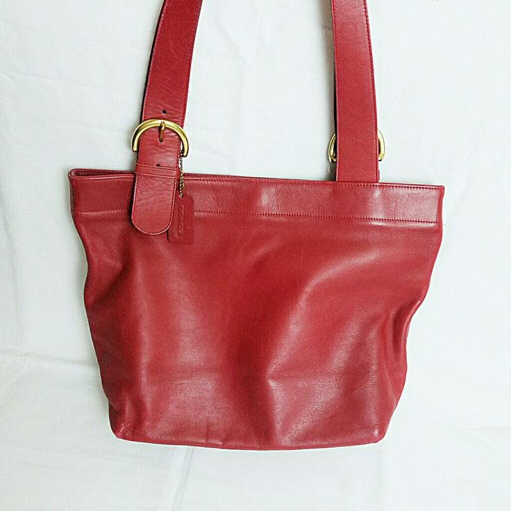 This Lucious Red Leather Coach Tote Has Been Loved By Both My Sister And My Mom. There Are Wear Marks On The Bottom Corners And Some Scratching On The Sides, Possibly Cat Scratches (About A Dozen). Handles And Solid Brass Hardware Are In Great Shape Though. The Inside Is Clean With No Staining. Overall, Still A Gorgeous Bag From 2005. Willing To Negotiate Price Slightly. Height: 11 Inches Length: 15 Inches Base Width: 5 Inches Handle Drop: 12 Inches/Adjustable Classic Red Satchel With Leather Handles, Red Leather Handle Bucket Bag, Red Leather-handled Bucket Bag, Coach Red Bucket Bag, Red Coach Shoulder Bag With Detachable Handle, Red Coach Bucket Bag, Classic Red Shopping Bag, Classic Red Bag With Detachable Handle, Classic Red Bags With Leather Handles