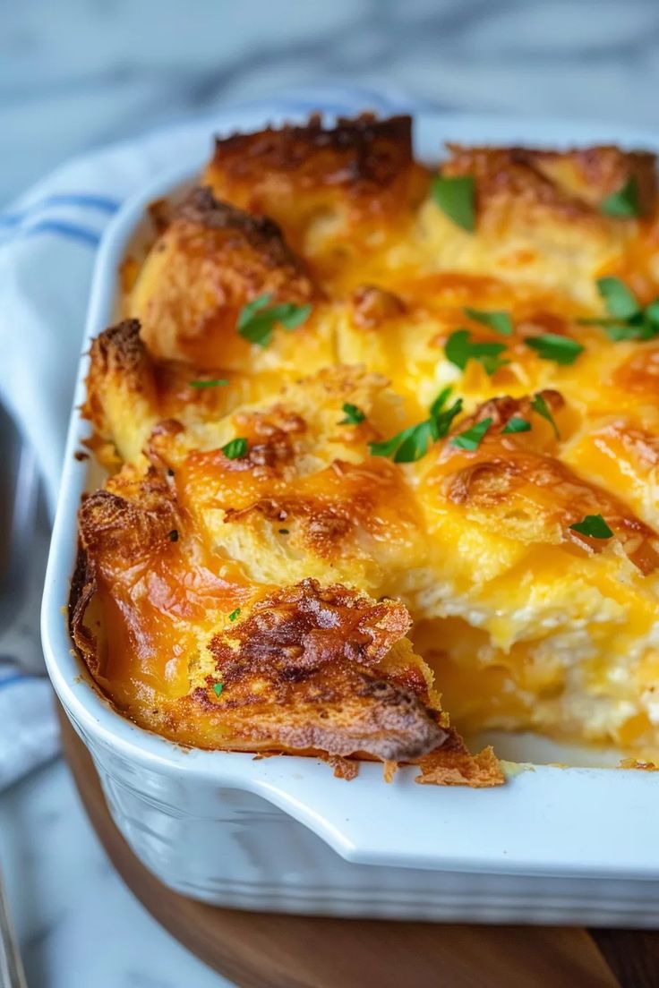 a casserole dish with cheese and parsley