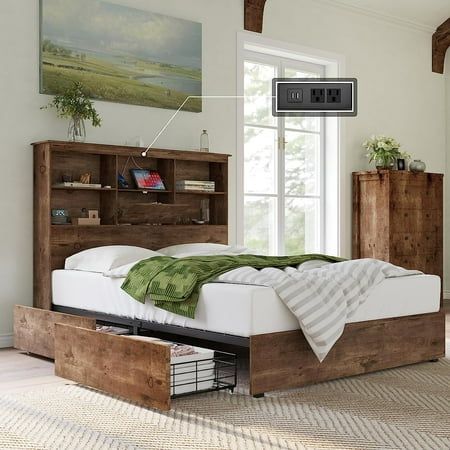 a bed sitting in a bedroom next to a wooden book shelf with drawers on each side