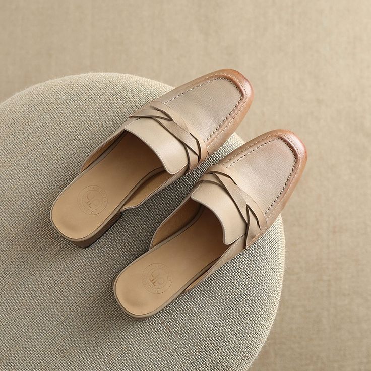 Shoes For Flying Step into comfort and style this summer with our chic Leather Mules. Perfectly designed for the office lady who loves to blend professionalism with a dash of casual flair, these slippers are a must-have for your warm-weather wardrobe. Crafted from high-quality genuine cow leather, these mules are a testament to durability and elegance. The low square heel provides just the right amount of lift, ensuring comfort throughout the day. Features Material: Premium genuine cow leather upper and pigskin lining ensure your feet stay comfortable and breathable. Heel: A modest 3cm square heel adds the perfect amount of height without sacrificing comfort. Design: Sleek, shallow-cut mules with a solid pattern and retro style, ideal for a variety of occasions. Season: Specially designed Elegant Everyday Slip-ons With Flat Heel, Elegant Slip-on Slippers With Round Toe, Leather Slip-ons For Formal Summer Wear, Beige Leather Sole Slip-ons For Work, Spring Leather Open Toe Slip-ons, Formal Beige Slip-ons For Spring, Classic Round Toe Slip-ons For Spring, Summer Slip-on Mules With Leather Sole, Chic Beige Almond Toe Slip-ons