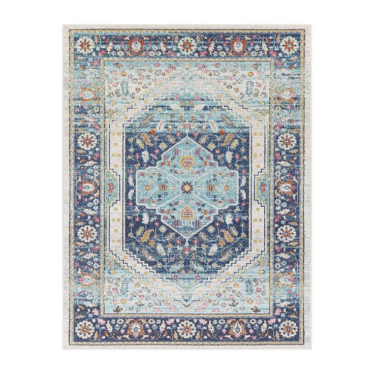 a blue and white rug with an ornate design