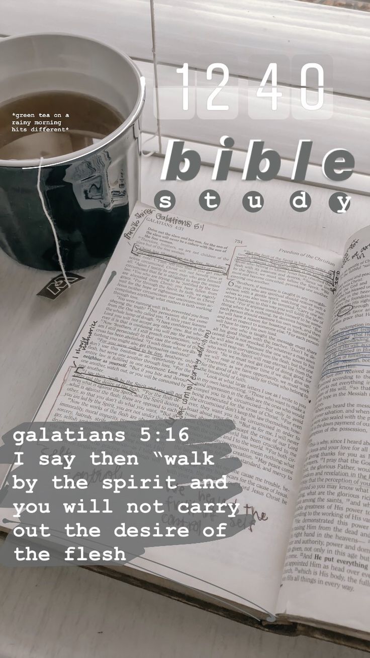 an open bible next to a cup of tea