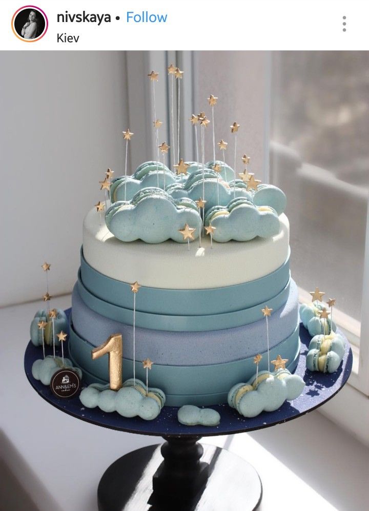 a blue and white cake sitting on top of a table