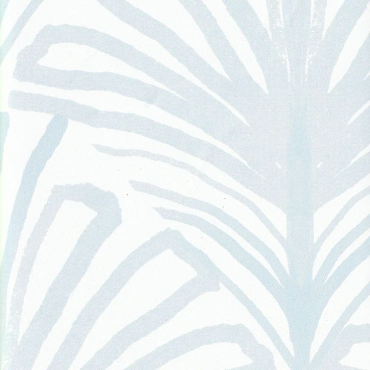 a blue and white wallpaper with palm leaves on it's back drop down