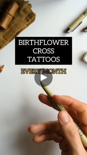 a person holding a pen in their hand with the words, birthflower cross tattoos every month