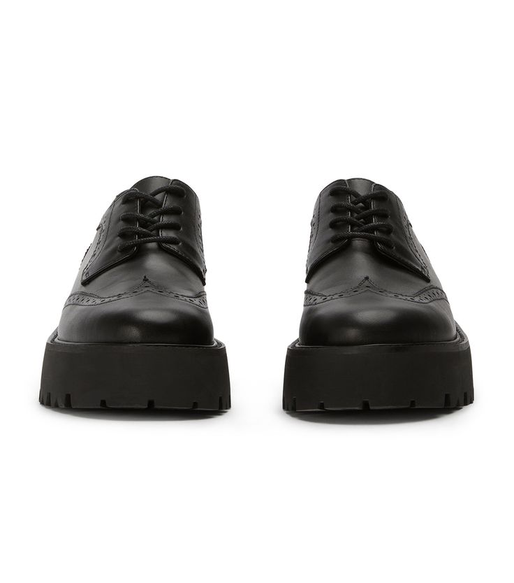 Meet Marni, this leather lace-up features a subtle platform sole and intricate detailing. Finished in our signature black como leather, they are sure to become a new fav. -Material: Leather -Sole: Rubber -Fit: True To Size -Toe-shape: Round -Features: Intricate Detailing -Heel: 5.5cm Black Leather Platform Lace-up Shoes, Black Platform Lace-up Shoes With Almond Toe, Platform Lace-up Shoes With Round Toe For Derby, Black Leather Oxfords With Chunky Platform, Leather Oxfords With Chunky Platform And Round Toe, Leather Chunky Platform Oxfords For Formal Occasions, Leather Low-top Platform Oxfords, Black Leather Lace-up Platform Loafers, Leather Platform Oxfords For Work