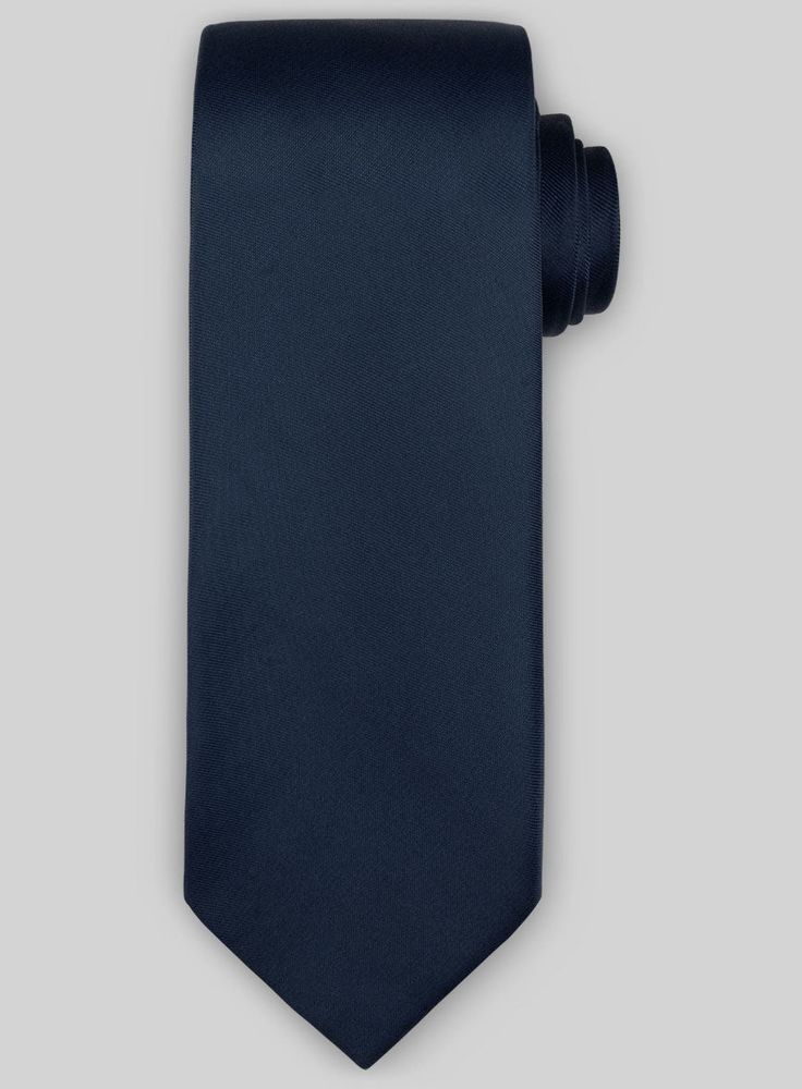 It's not just wedding and work guys are getting dressed up for these days, making a stylish selection of tailoring accessories essential for every man's wardrobe. 
 
 This tie would compliment your suits or blazers and will stand out with it's solid finish. 
 
 A must have for your neckwear collection that you won't find anywhere else. 
 
 Width at widest : 2.75 inches. Modern Standard Tie For Office, Modern Standard Tie For Semi-formal Occasions, Modern Standard Tie For Semi-formal Events, Classic Navy Ties For Work, Dapper Solid Ties For Black Tie Occasions, Dapper Standard Tie Neckwear, Dapper Standard Tie For Work, Tailored Professional Standard Tie, Solid Dapper Ties For Formal Occasions