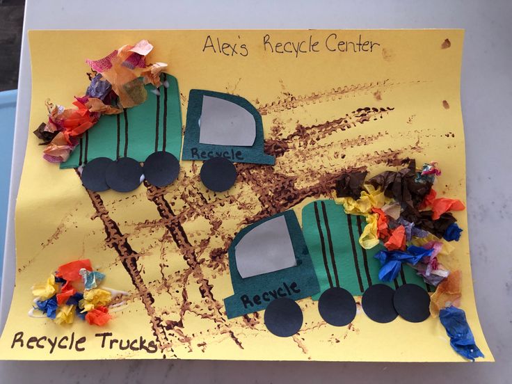 a child's craft made to look like a construction truck with flowers on it