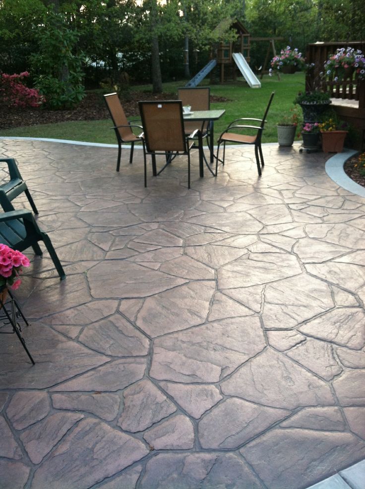 an outdoor patio with chairs and tables