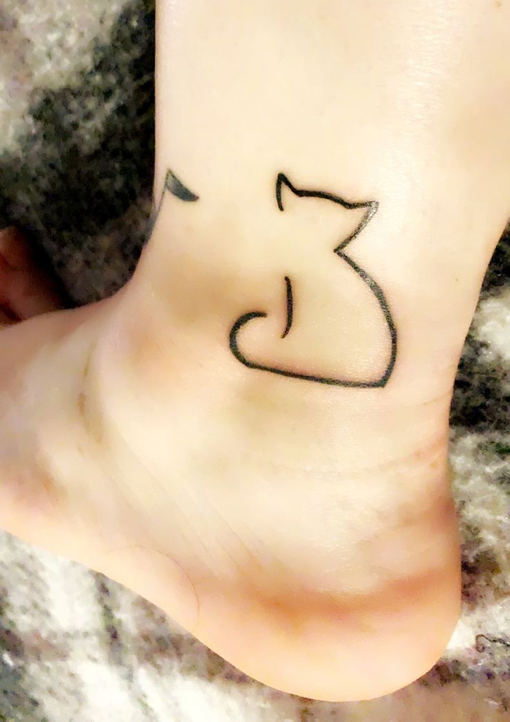 a person with a small tattoo on their foot