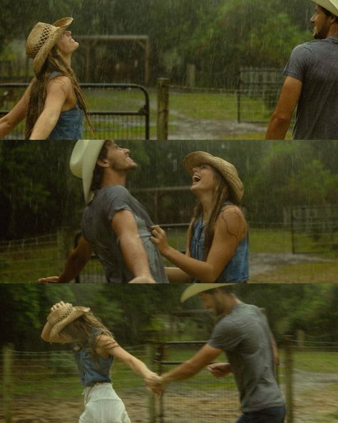 two people dancing in the rain with hats on