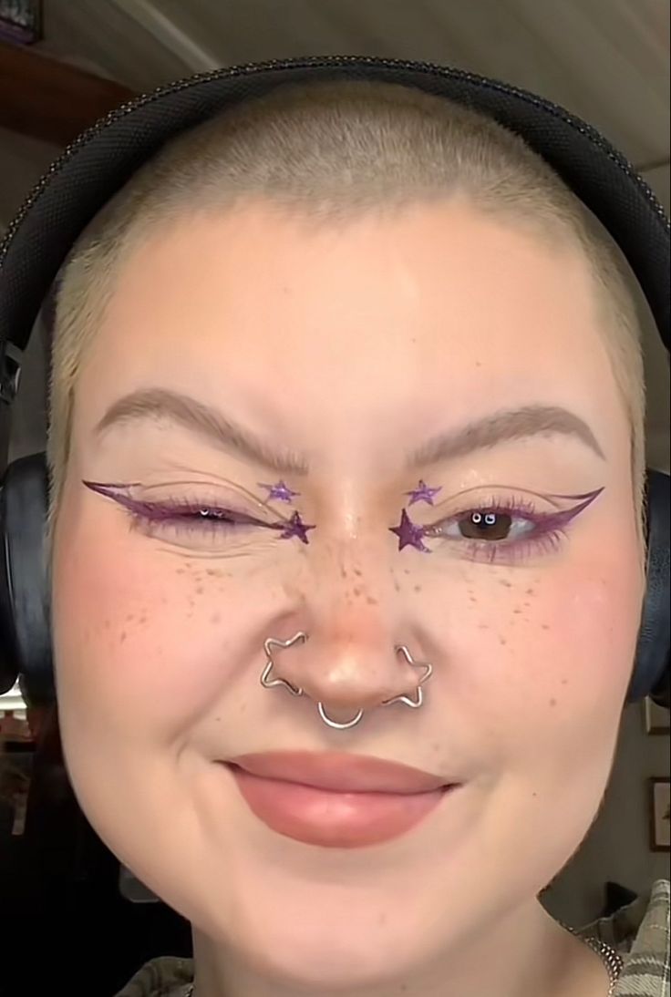 Star Shaped Nose Ring, Star Shaped Eyeliner, Star Makeup Inner Corner, Graphic Purple Eyeliner, Star Nose Rings, Star Graphic Liner Makeup, Purple Graphic Liner Makeup, Graphic Liner Purple, Rock Star Eye Makeup