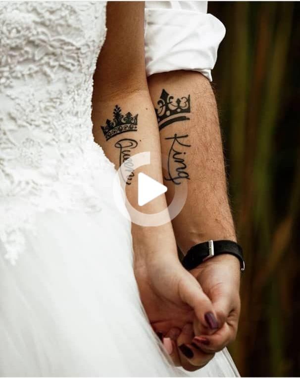 the bride and groom are holding hands with tattoos on their arms that read king and queen