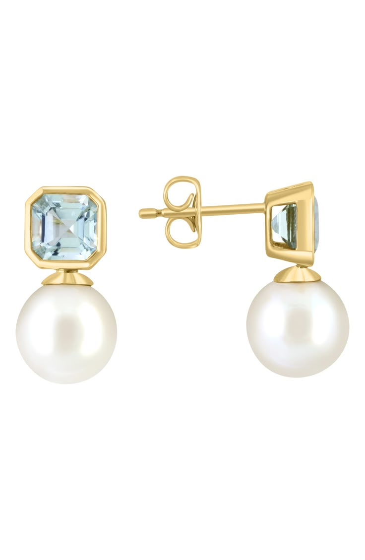 Polished 14-karat yellow gold stud earrings showcase bezel-set square-cut aquamarines nestled atop lustrous freshwater pearls for elegant shine. 1/4"W x 5/8"L Post back Total aquamarine weight: 2.0ct. Pearl size: 9mm 14k gold/aquamarine/freshwater pearl Made in the USA Aquamarine Wedding Earrings, Aquamarine Pearl Earrings, Elegant Aquamarine Earrings, Elegant Blue Aquamarine Earrings, Blue Aquamarine Gemstone Earrings, Expensive Jewelry Luxury, Aquamarine Earrings, Aquamarine Jewelry, Expensive Jewelry