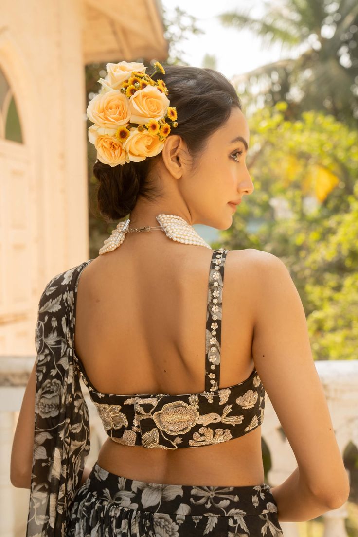 Showcase timeless elegance with this black vintage floral printed pre-draped sari, paired with a fully hand-embroidered blouse. The intricate craftsmanship and classic design create a sophisticated and graceful look. Elegant Fitted Pre-draped Saree With Motifs, Festive Floral Print Blouse For Reception, Party Blouse Piece With Traditional Drape And Printed Motifs, Silk Floral Print Blouse Piece For Reception, Elegant Pre-draped Saree With Floral Embroidery For Festive Occasions, Elegant Evening Choli With Floral Embroidery, Elegant Festive Pre-draped Saree With Floral Embroidery, Elegant Floral Embroidered Pre-draped Saree For Festive Occasions, Evening Saree With Floral Embroidery