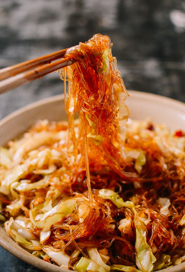 chopsticks are being used to stir food in a bowl